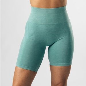 Alphalete biker shorts in jade green